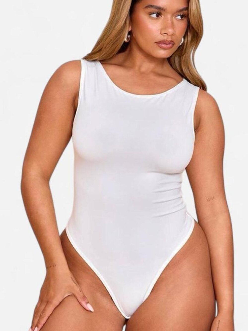 white sleeveless scoop-neck bodysuit by Boohoo